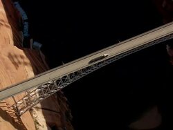 WS AERIAL DS ZO View of Truck and car moving on Hoover Dam bypass bridge / Arizona, United States Stock Footage