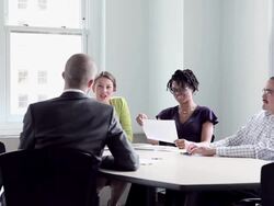 MS DS coworkers discussing project in office conference room Stock Footage