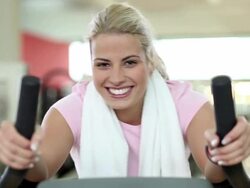 Young woman cycling Stock Footage
