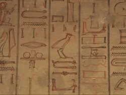 Medium Close Up, pan-right  tracking-right - A mural depicts hieroglyphics / Egypt Stock Footage