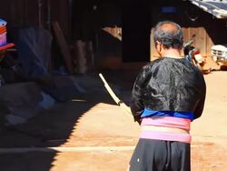 HD:Karen man in traditional costumes playing a flute. Stock Footage