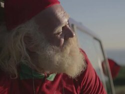 C/U Santa waking up in a van Stock Footage
