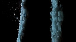 SLO MO night shot of ice climber ascending steep slope Stock Footage