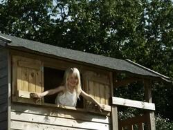 Girl in tree house (shot on Red) Stock Footage