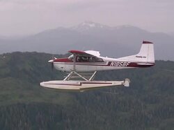 "Sea plane flying over evergreen forests, shot from adjacent sea plane, Revillagigedo Island, Alaska." Stock Footage