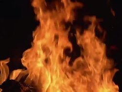 CU SLO MO Bonefire, Fire flames in campfire / Moremi Reserve, Botswana, South Africa Stock Footage