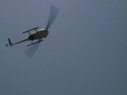 Helicopter Rotates Clockwise in Air Stock Footage