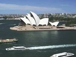 The Opera House with Ferry Boats passing, Sydney, New South Wales, Australia Stock Footage