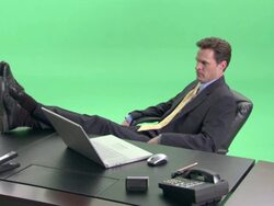 MS, Bored businessman throwing paper plane at desk in studio Stock Footage