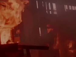 MS TS Sholt of Fireman pulling down burning piece of furniture Stock Footage