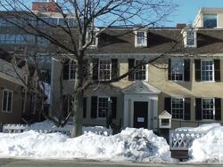 MS Shot of car passing away from house in residential neighborhood with snow covered sidewalk / Boston, Massachusetts, United States Stock Footage