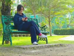 Dolly Shot:Girl play smart phone Stock Footage