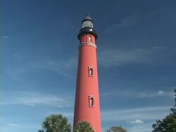 Lighthouse on blue sky Stock Footage