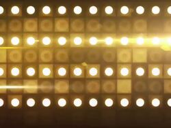Bright Flood Lights Background Loop - Gold Glow (Full HD) Stock Footage