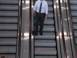  HA Businessmen high-five each other as they pass on escalator / Seattle, Washington, United States Stock Footage