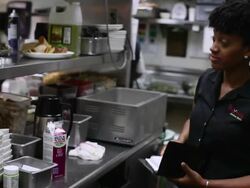 MS PAN Woman putting order in kitchen  / Truxton's, California, USA Stock Footage