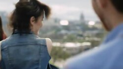 Friends dance and cheer on rooftop overlooking downtown Austin, Texas Stock Footage