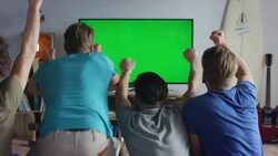 Guys sitting on couch watching tv and cheering Stock Footage