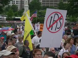Gadsden and IRS sign at Audit the IRS rally in DC Stock Footage
