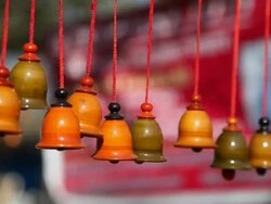 Wooden bells hanging on a shop in a fair  Stock Footage