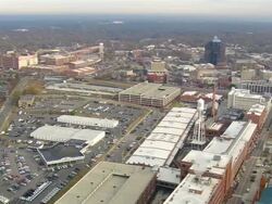 WS AERIAL View of City with Durham cigarette companies / North Carolina, United States Stock Footage