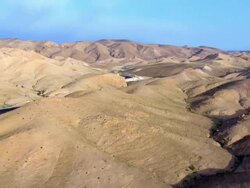 AERIAL WS PAN View of Judea desert / Masada, Sourn Judea Desert, Israel Stock Footage
