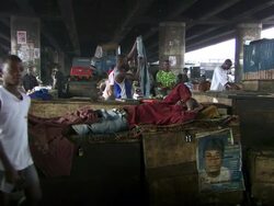 WS View of people living and working under road bridges / Lagos, Nigeria Stock Footage
