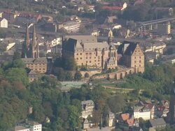 MS AERIAL Shot of St. Elizabeth Church and Marburg castle with other houses / Germany Stock Footage