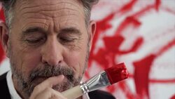 Artist thinking in front of his painting Stock Footage