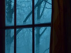 MS TD ZO Snow storm through windows with fireplace and chair / Tweed, Ontaria, Canada Stock Footage