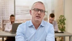 Senior project manager on video call Stock Footage