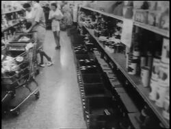 B/W 1962 women with shopping carts in grocery store aisle during Cuban Missile Crisis Stock Footage