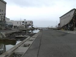 Destruction caused by tsunami after magnitude 9 Tohoku earthquake, north east Japan, March 2011. Warehouse and road destroyed by tsunami in Ishinomaki City port, Miyagi Prefecture Stock Footage