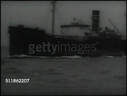 1937: MARITIME COMMISSION: VS Ships on sea, cargo carriers, freighters. WASHINGTON, D.C.: Angled WS Department of Navy 'main' building. MS Chief of US Naval Operations William Leahy sitting at desk SOT saying Merchant Marines part of defense. Instructional Video