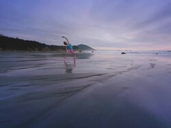 WS POV ZI Woman doing yoga on beach / Bandon, OR, United States  Stock Footage