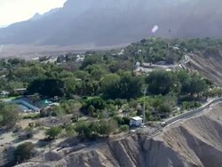 WS AERIAL POV View of dead sea shore near city in desert / Ein Gedi, Judea Desert, Israel Stock Footage