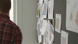 MS Businessman pinning project ideas on board in office Stock Footage