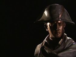 A bust of Napoleon Bonaparte slowly rotates against a black background. Stock Footage