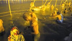 Kumbh Mela Hindu festival, 2013, occurs every 12 years. Religious pilgrims taking holy bath in the Ganges River, Allahabad. Stock Footage