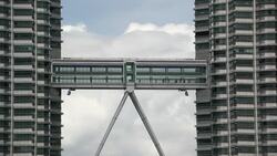 A sky bridge connects the two towers of the Petronas Towers in Kuala Lumpur, Malaysia. Stock Footage