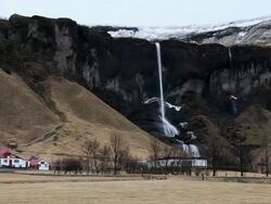 WS View of Residences around waterfall / Iceland  Stock Footage