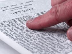 HD Reading Genesis 1 Close-up (Rack Focus) (4:2:2) Stock Footage