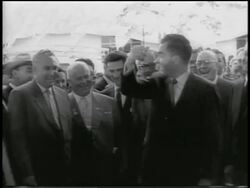 B/W 1959 Nixon cutting ribbon as Khrushchev laughs, claps + shakes his hand / Moscow Stock Footage