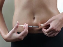 HD DOLLY: Injecting Insulin In The Stomach Stock Footage