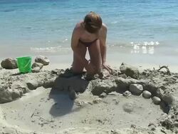 MS Girl playing at beach in holiday / Puerto Pollenca, Mallorca, Balearic Islands, Spain Stock Footage