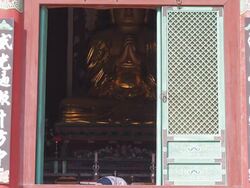 MS Shot of People praying to Buddist statue in Beopjusa(head temple of the Jogye Order of Korean Buddhism)Temple / Boeun, Chungcheongbukdo, South Korea Stock Footage
