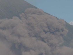 Ash explodes into the air from a volcanic pyroclastic flow, Philippines, Dec 2009 Stock Footage