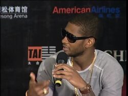 Usher exchanges  presents and learns first Chinese words at presser News Clip