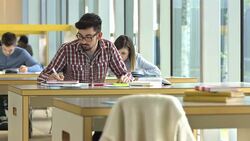 LS DS Student Writing An Assignment Stock Footage