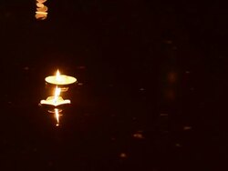 two candle on glass jar in coconut Krathong. Stock Footage